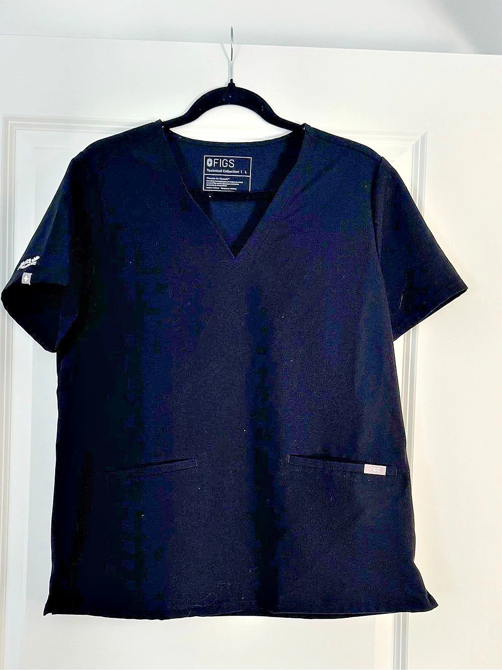 FIGS Catarina Scrub Top Black Short Sleeve size Large. Worn once. Side logo